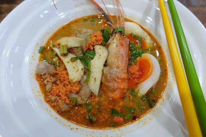 Bangkok After Dark: Pub Crawl Adventure - Stop 2 at The Pit Stop: Yadom shot, trivia, and group photos