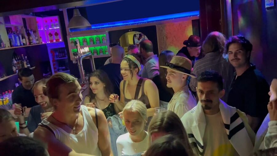 Lisbon Pub Crawl: Unlimited Drinks, Shots & V.I.P Club Entry - Bairro Alto on Foot: Where the Group Turns From Strangers Into a Crowd