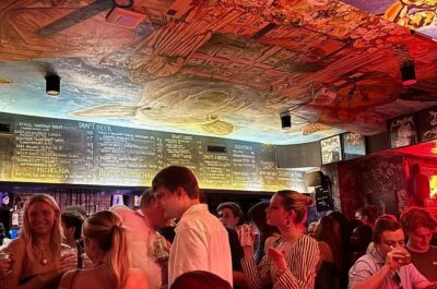 NYC Pub Crawl Tour - Stop Two in the Lower East Side: louder clubs, bigger vibes, and a bonus shot