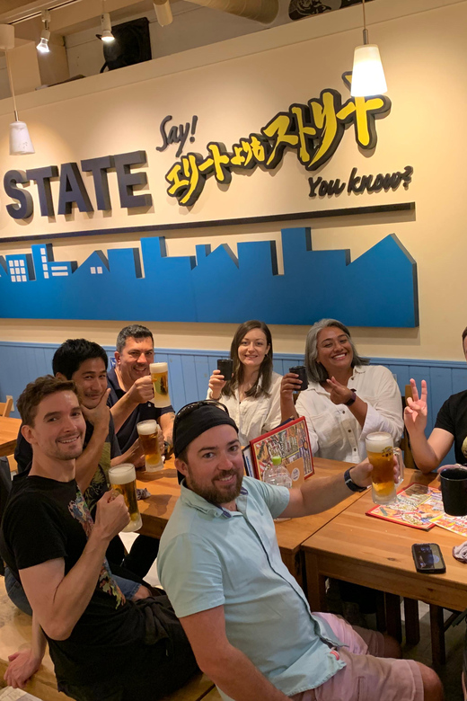 Osaka: Namba Pub Bar Crawl with a Local Guide - Meeting at Apple 心斎橋 and finding your fluorescent green-bag guide